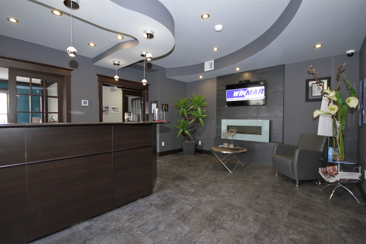 Reception area with sitting area to the right to greet all customers and adjusters